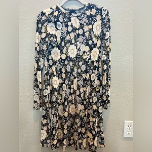 A Tucker + Tate extra large black dress with a floral design.